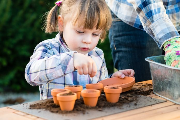 Child sowing seeds 696x465 1