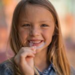 How do international Montessori classrooms integrate glass painting to develop a child’s concentration and artistic expression effectively?